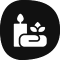 Icon of a lit candle and soap with a leaf, symbolizing relaxation and cleanliness.